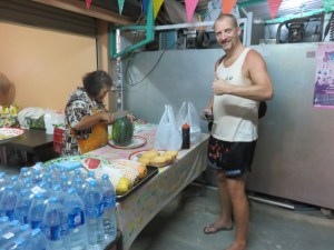 Getting some watermelon from the lady down the street