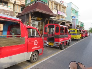 The tuk-tuk's look like "Economy classe russebusser" - gotta be Norwegian to take that joke