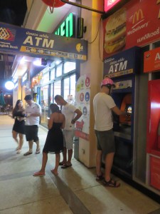 Getting money. Note the manly helmet